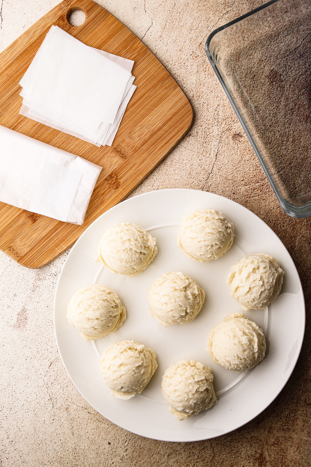 Arepa dough portioned out on a plate.