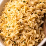 Buttery egg noodles cooked in one pot with a sprinkle of parsley.