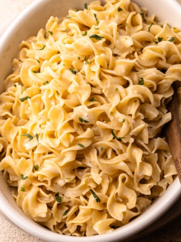 Buttery egg noodles cooked in one pot with a sprinkle of parsley.