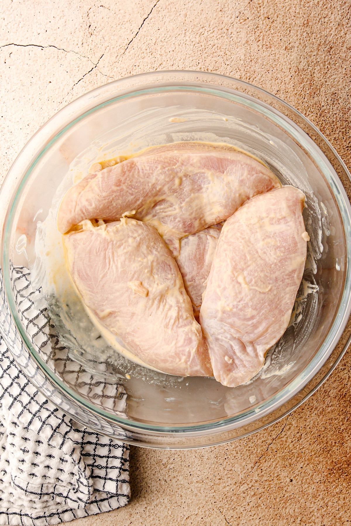 Marinading chicken breasts for a ritz cracker chicken recipe.