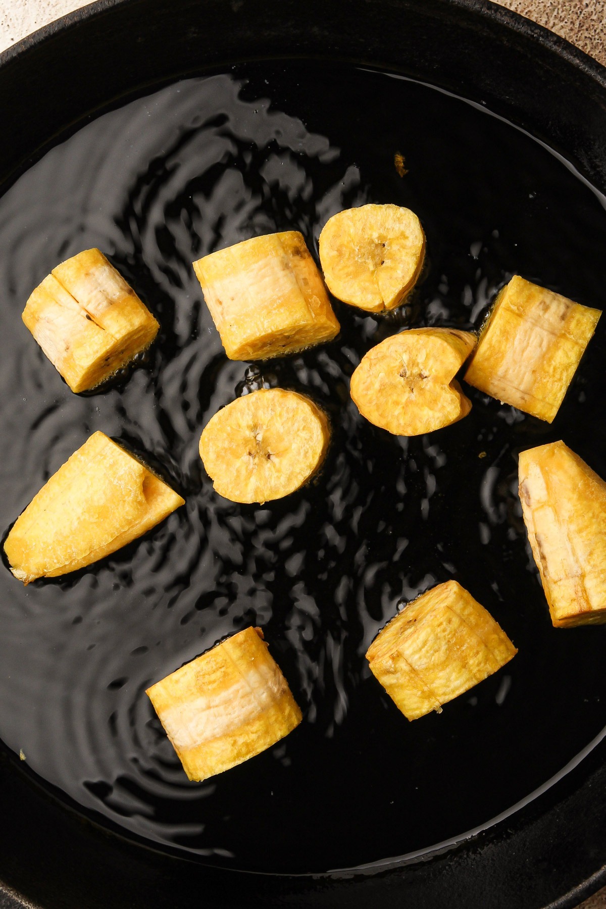 Frying plantains.