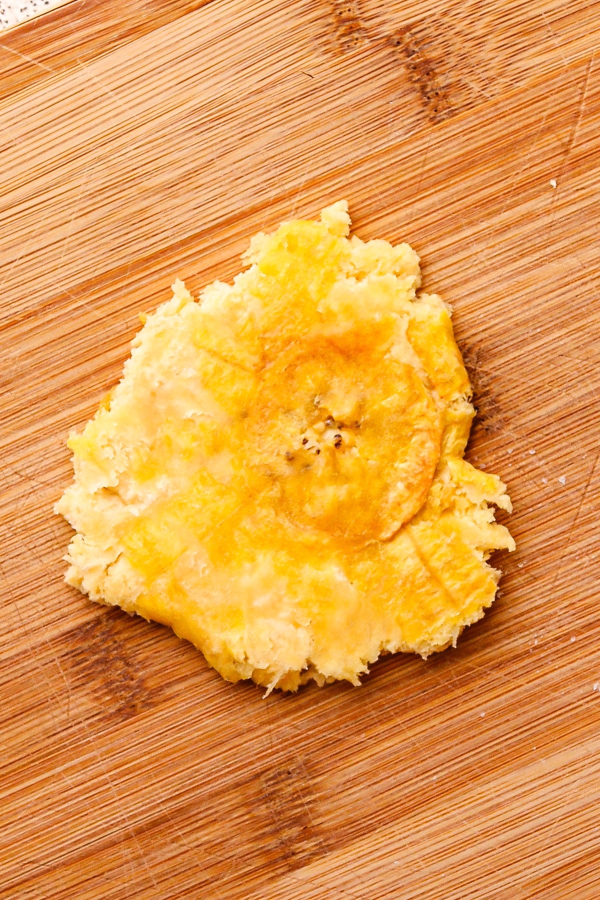 A smashed one-time fried green plantain.