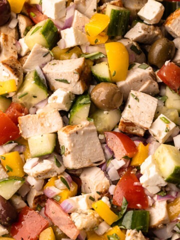 A chopped greek chicken salad fully assembled.