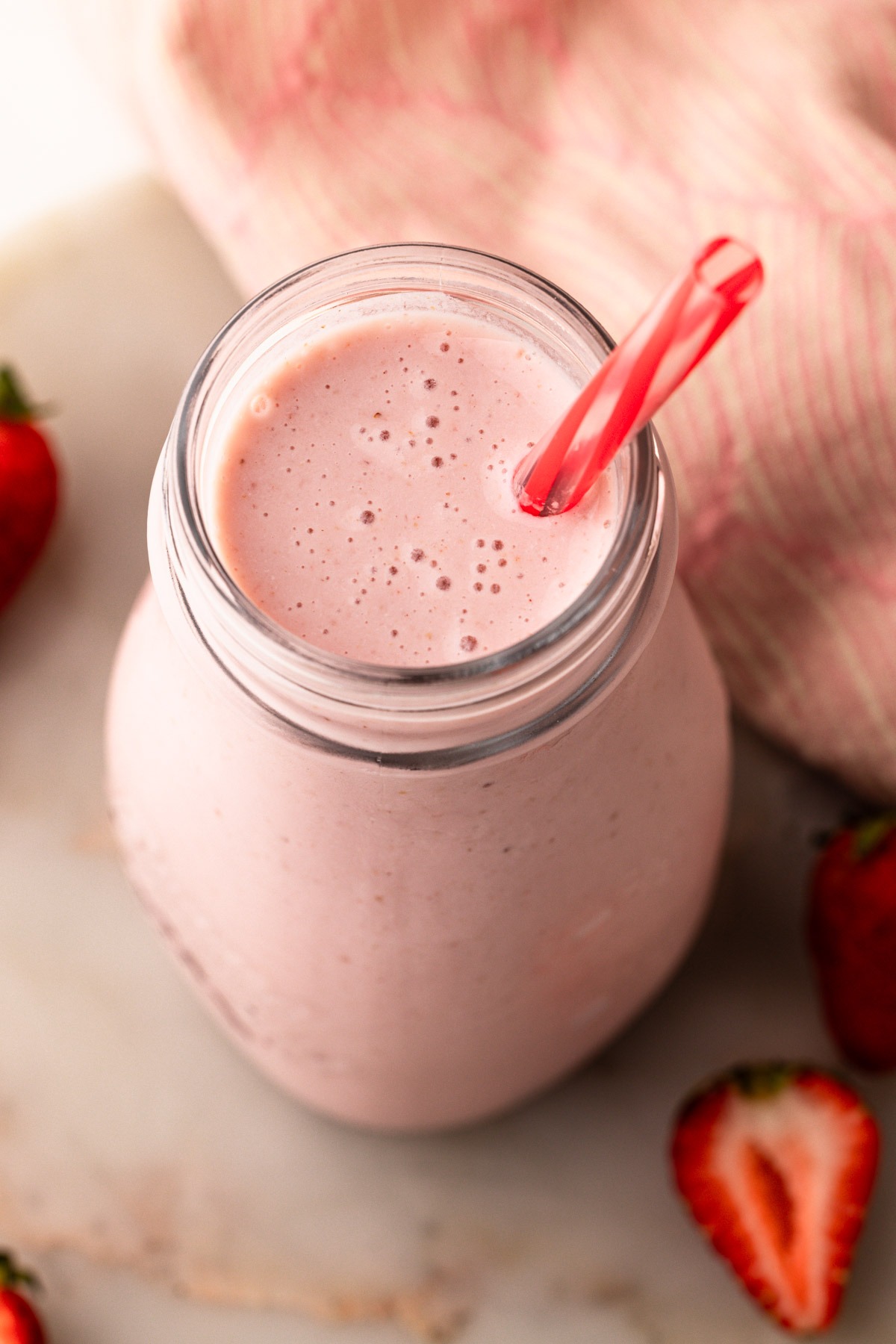 A bottle of strawberry milk made from scratch.