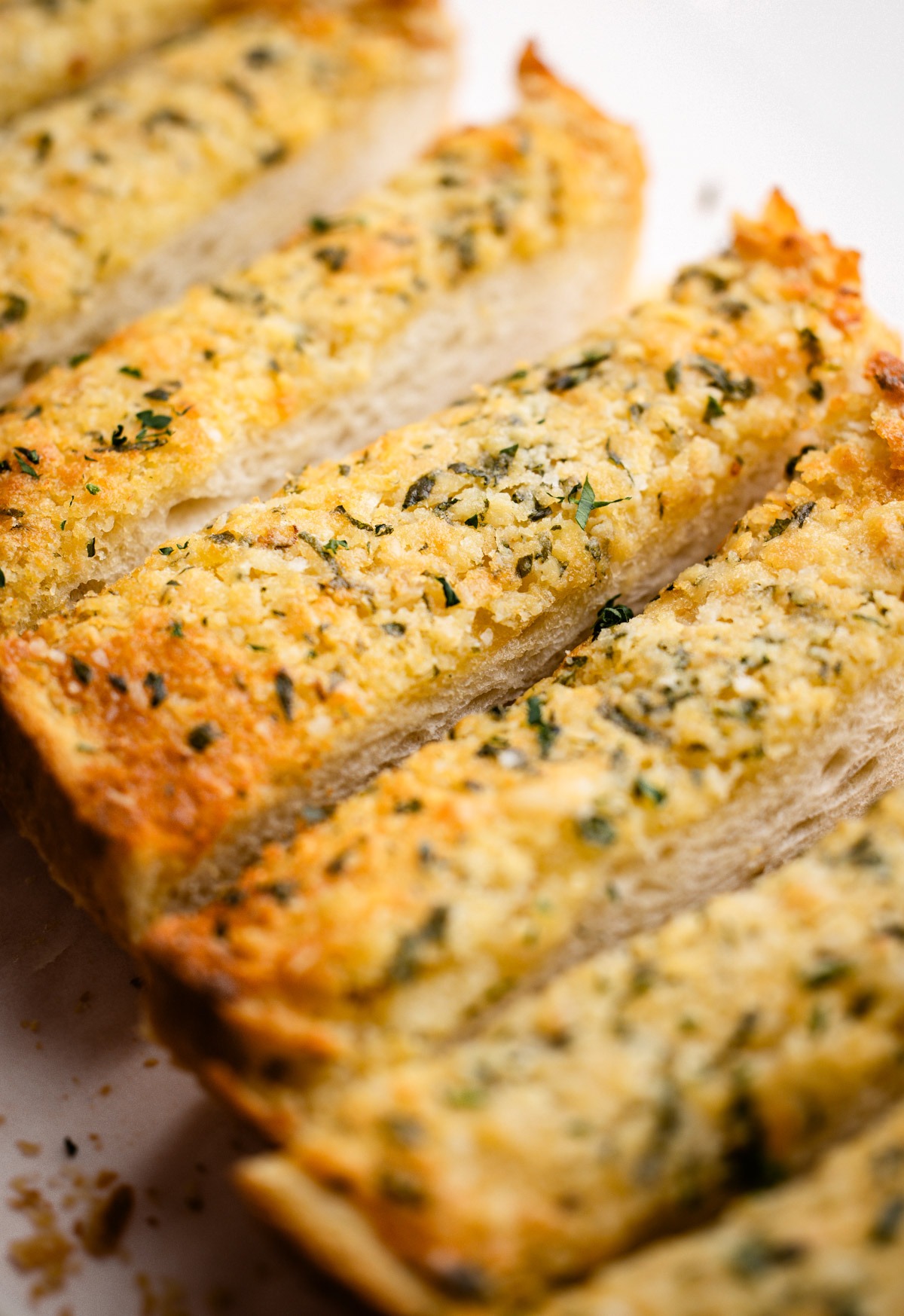 Homemade garlic butter brushed on bread and baked.