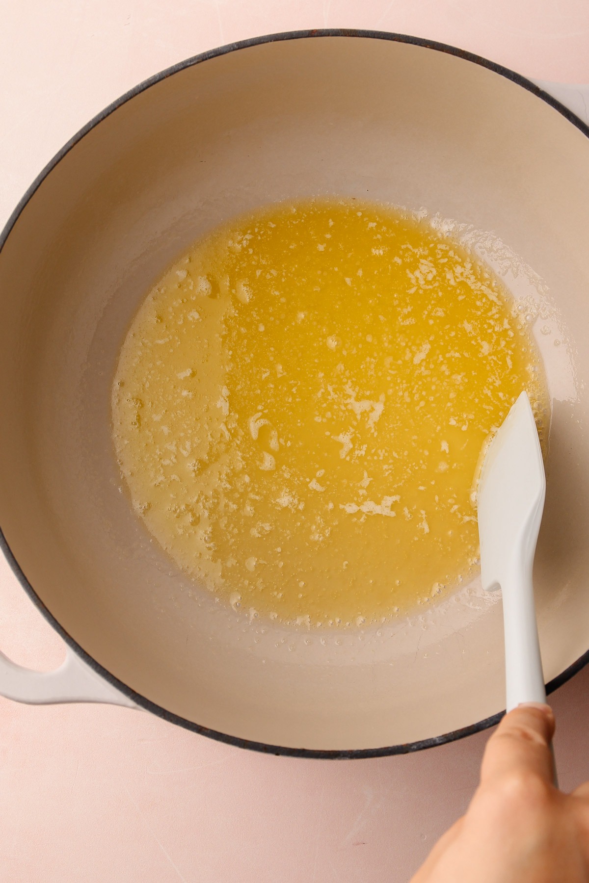 Melted butter in a pot for chocolate rice crispy treats.