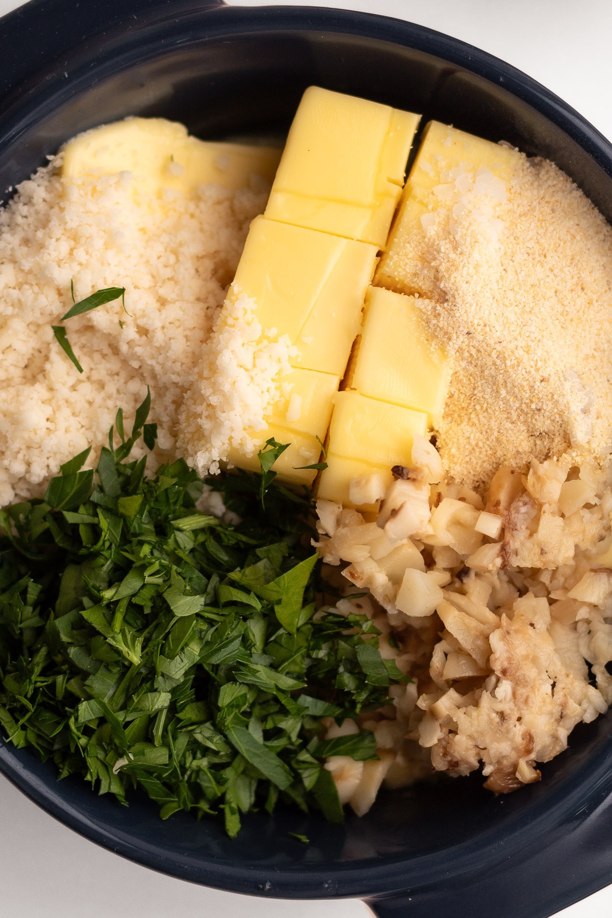 Ingredients for garlic butter in a bowl.