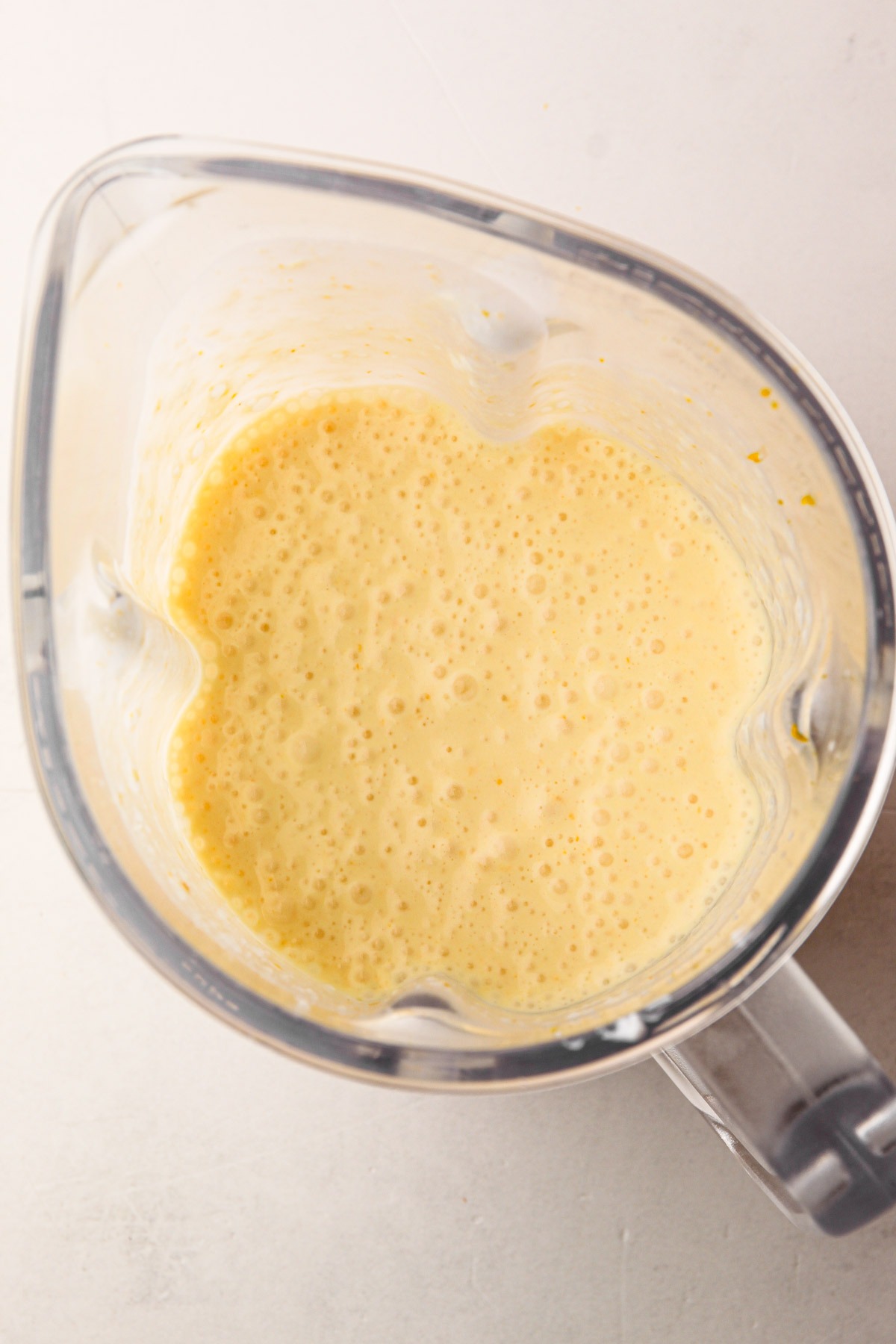 Blended orange creamsicle mixture in a blender.