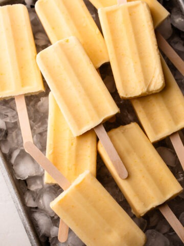 Orange creamsicles on ice.