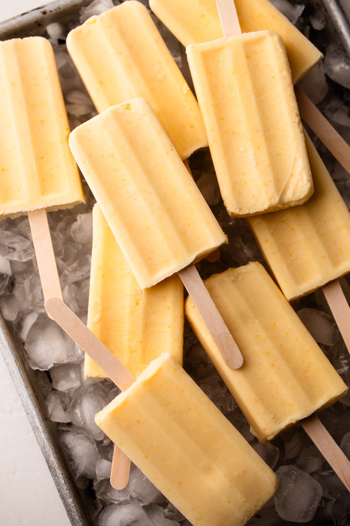 Orange creamsicles on ice.