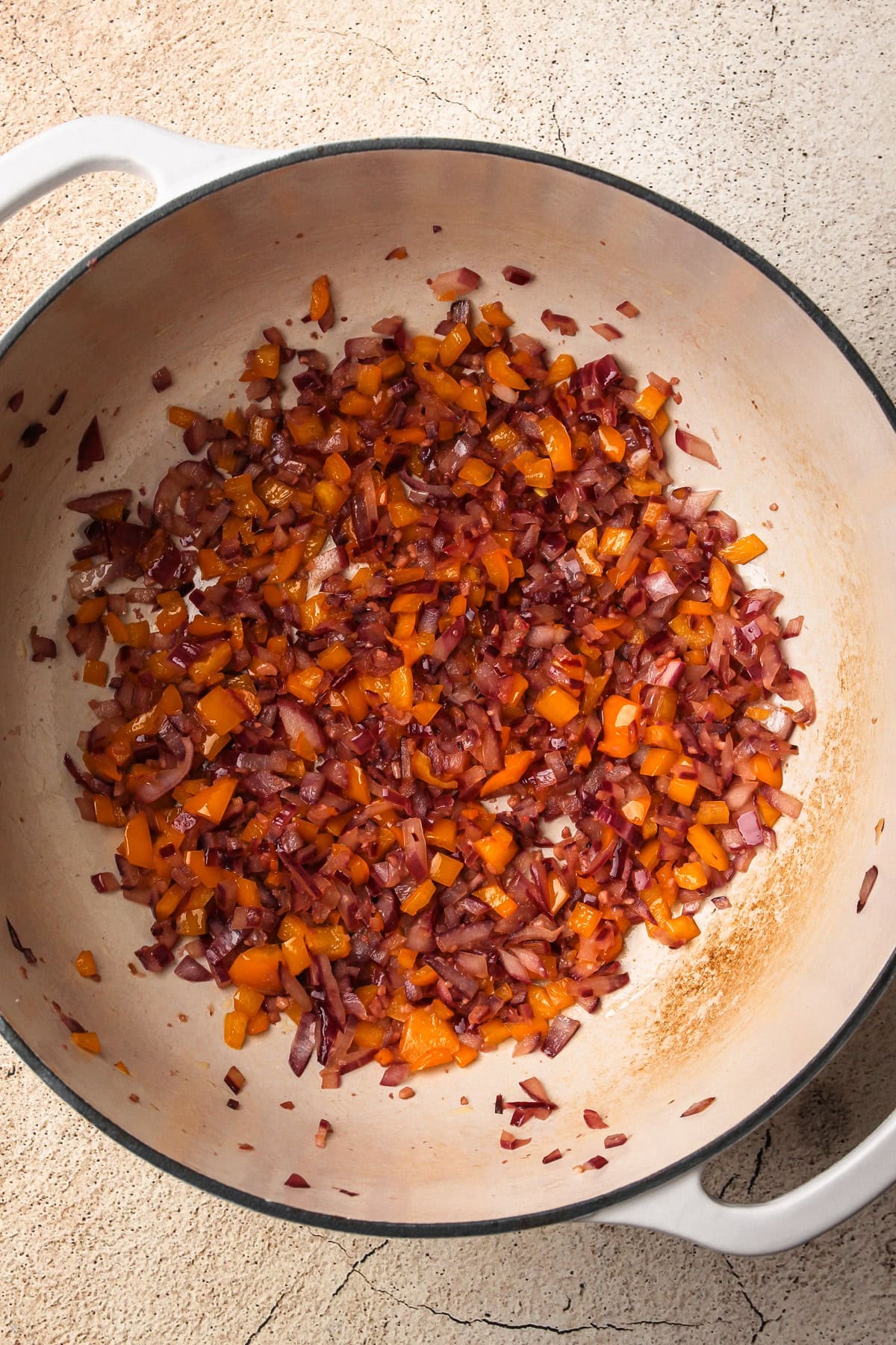 Sautéed vegetables for turkey chili in a Dutch oven.