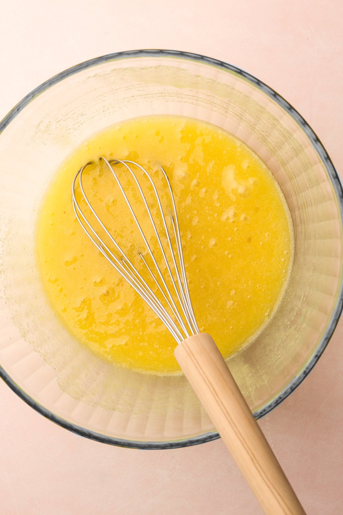 Whisked wet ingredients in a bowl for making snickerdoodles.