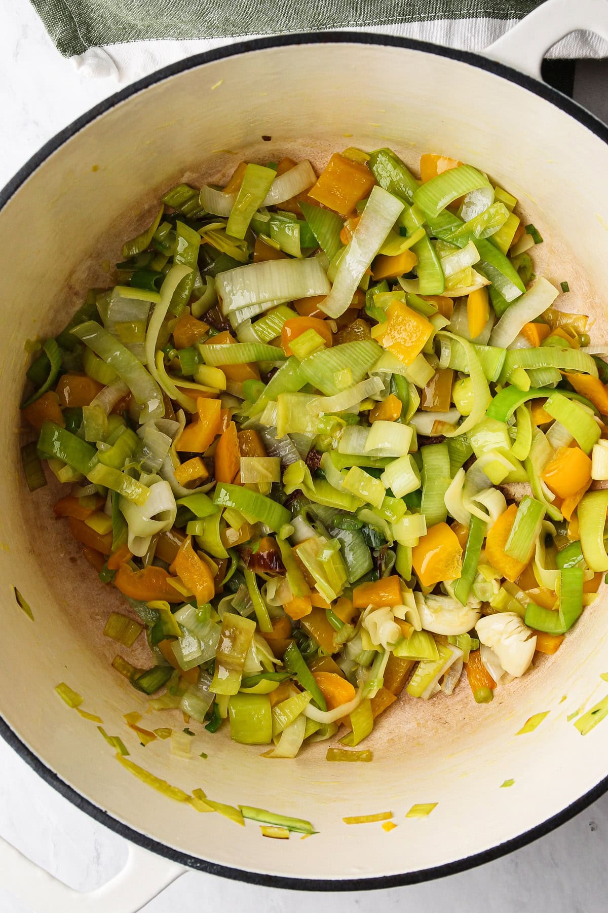 Sweating down veggies to prepare to make a green goddess soup.
