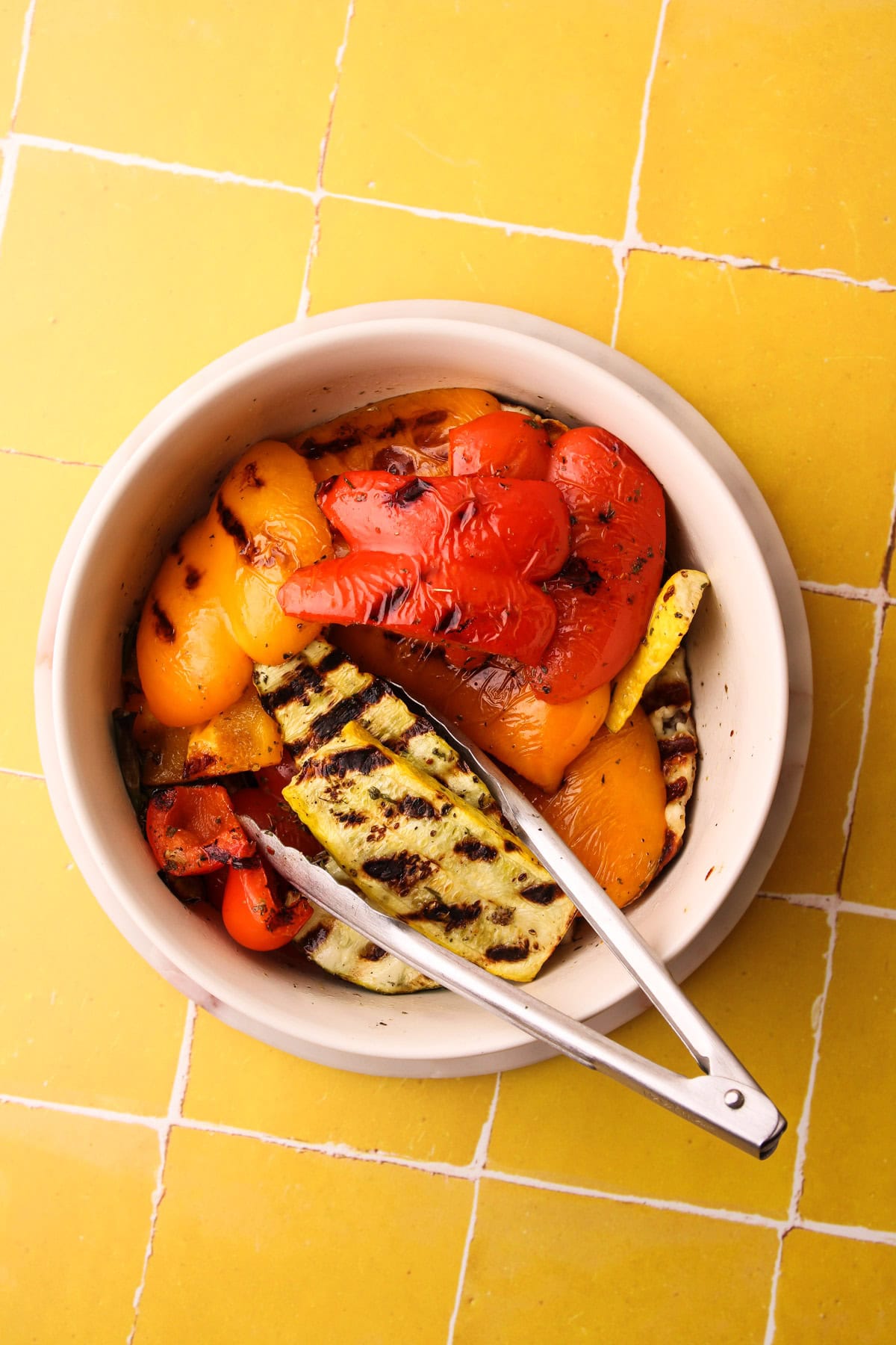 Grilled veggies in the marinade bowl.