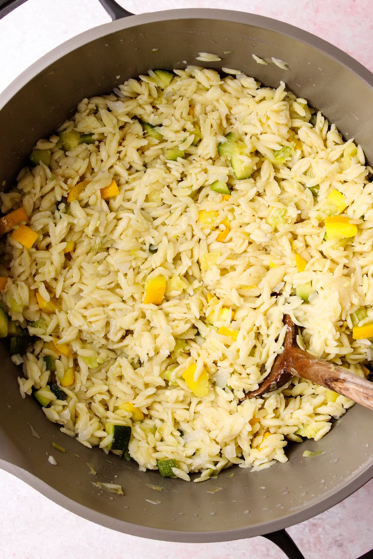Cooked orzo with zucchini before adding the pesto.