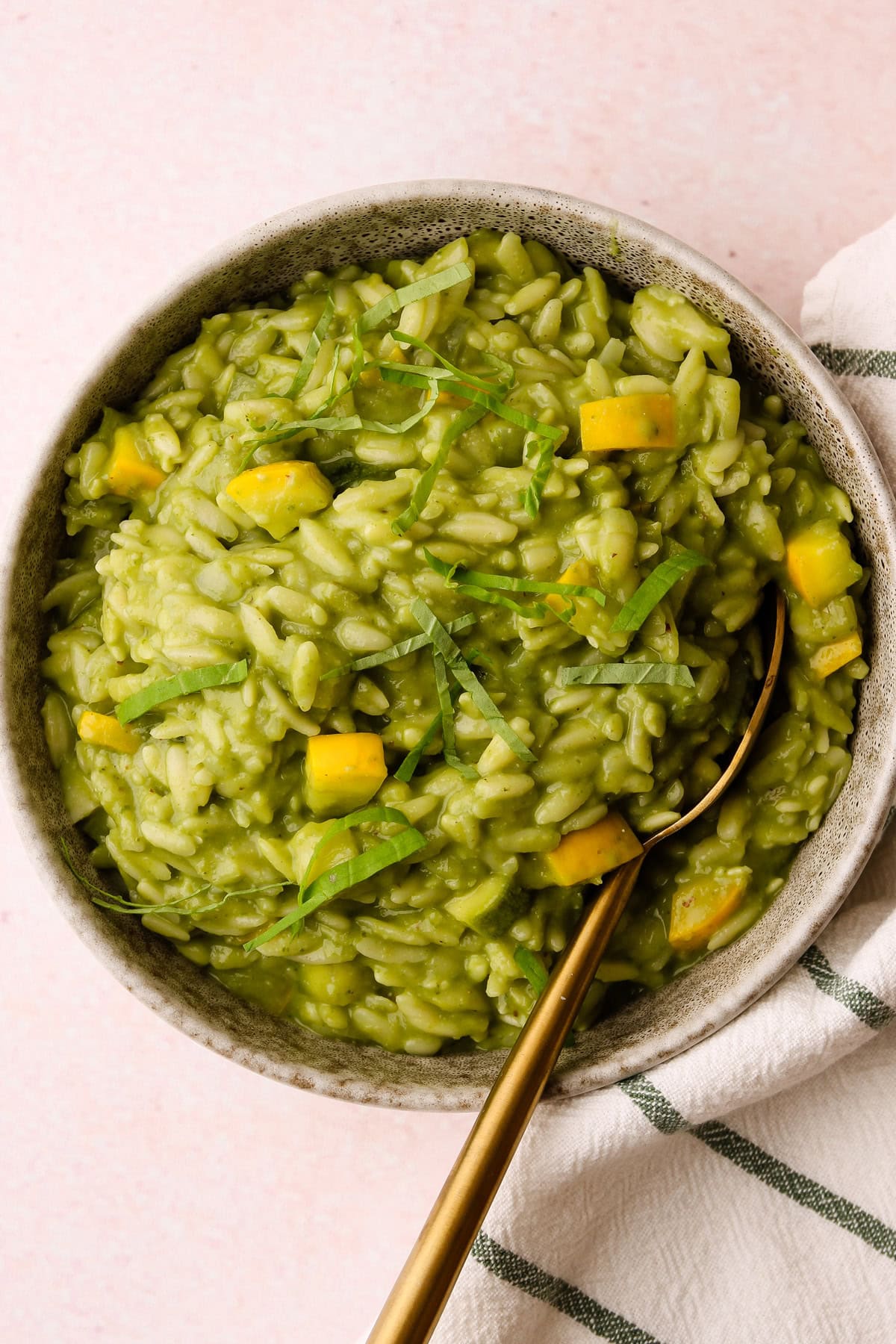 A serving of pesto zucchini orzo.