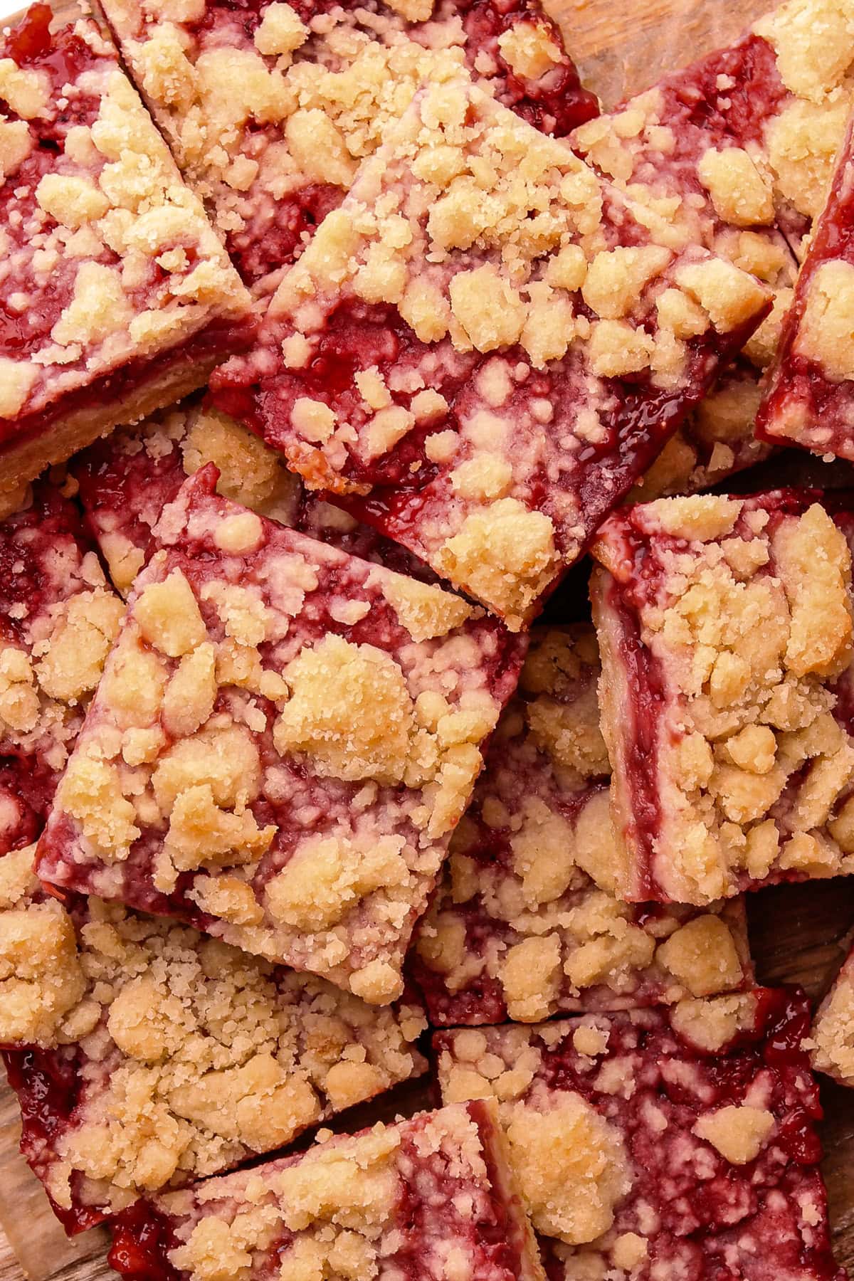 Baked and sliced strawberry crumble bars.
