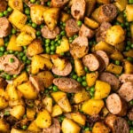 A fully cooked Sheet Pan Sausage and Potato dinner straight from the oven.