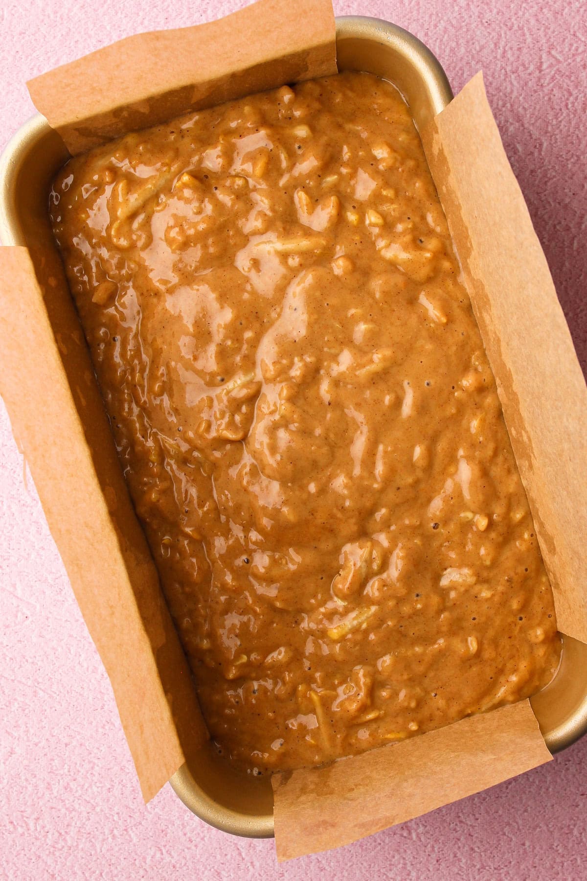 Unbaked zucchini bread in a bread pan.