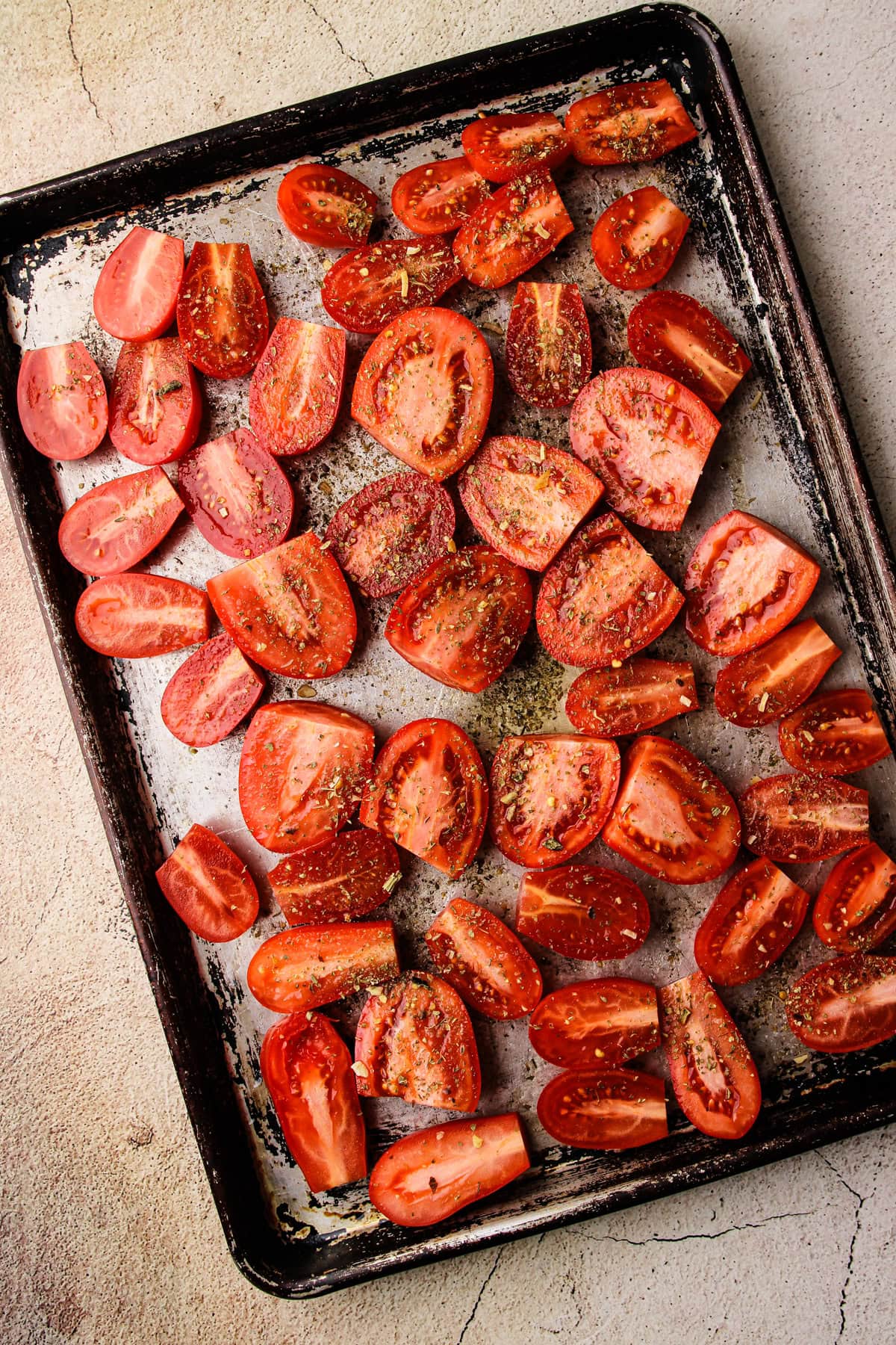 Seasoned tomatoes ready to roast for homemade tomato soup