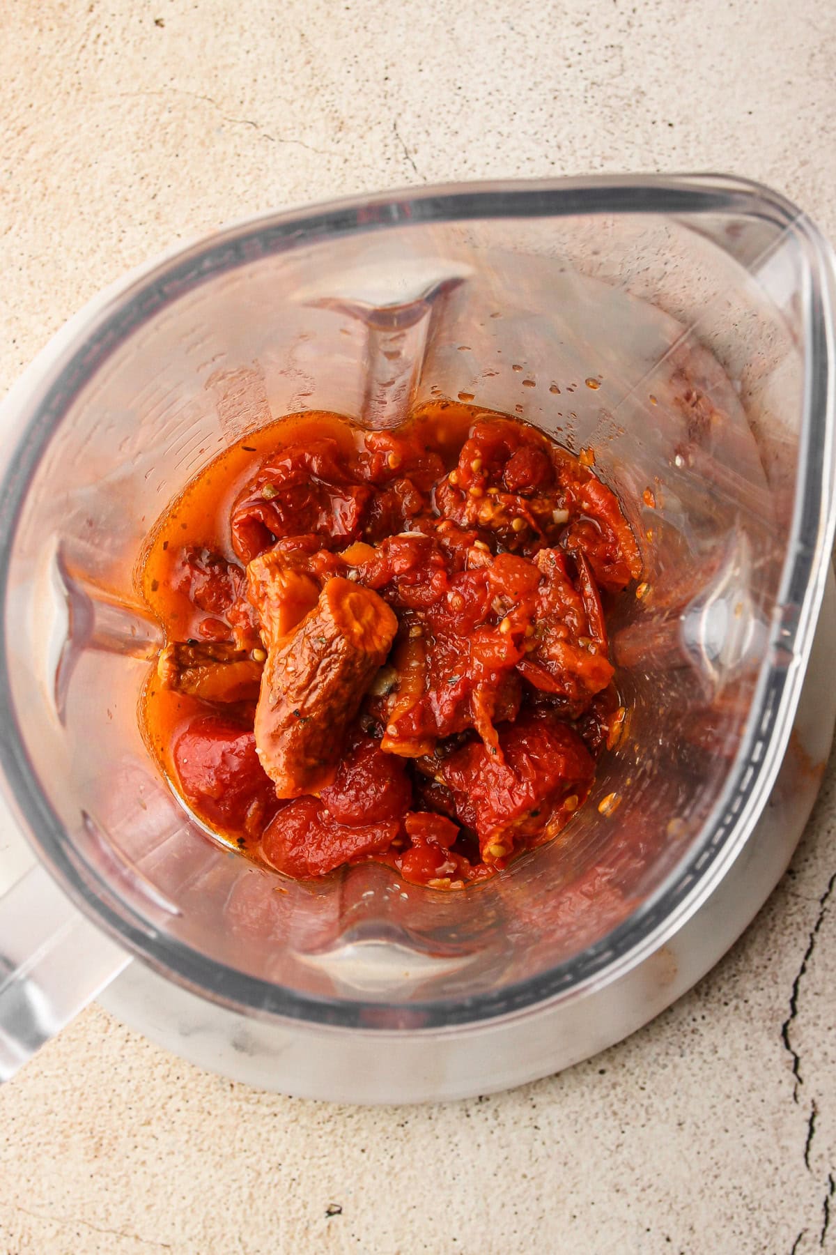 Roasted tomatoes and garlic in a blender before pureeing.